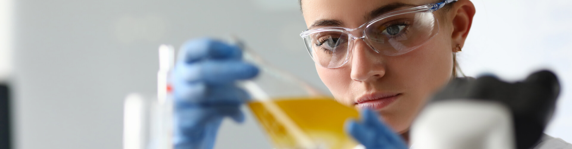 A scientist studies the content of a vial